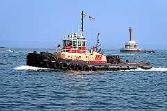 Tugboat Passes By Deer Island Lighthouse in Boston Harbor